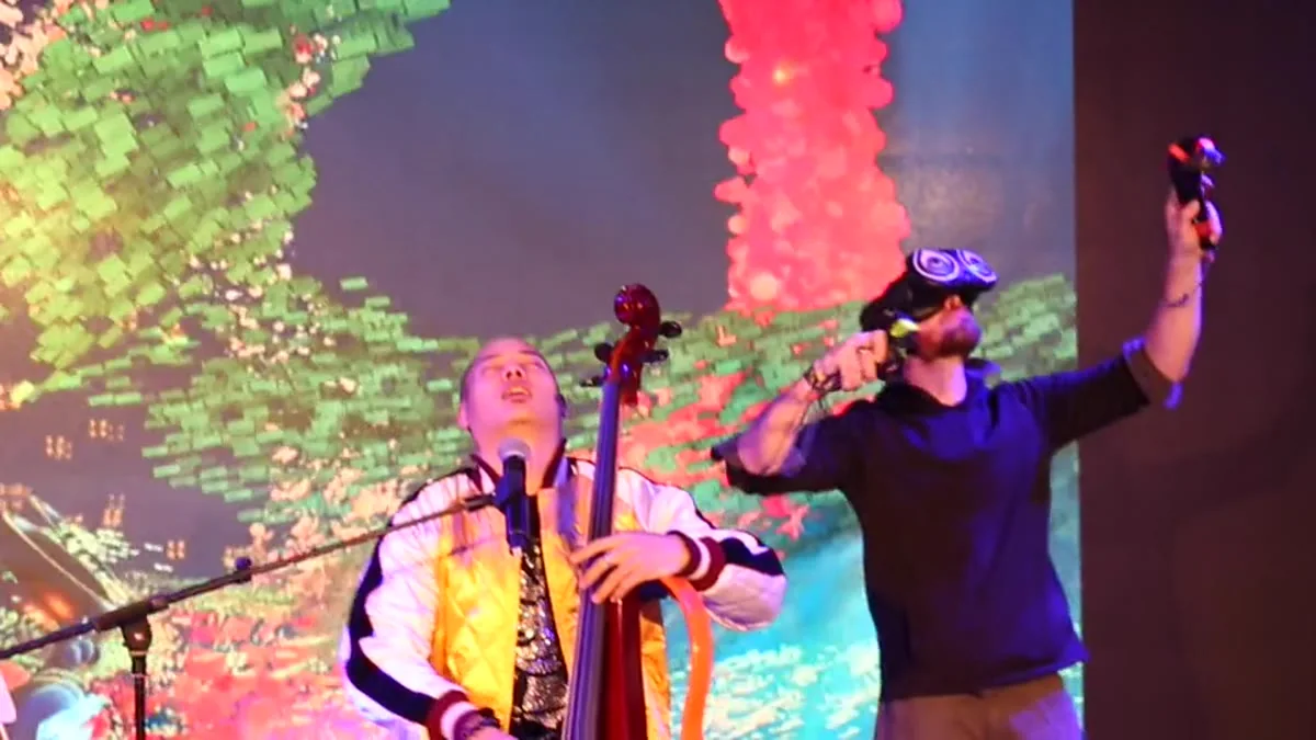 Dana Leong and a vocalist on stage at the Shanghai Arts Festival against vivid Android Jones visuals
