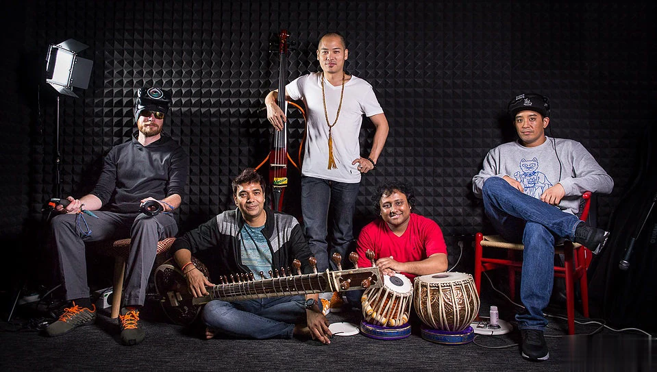 The TEKTONIK collective in the studio, five musicians with electric cello, sitar, tabla and turntables